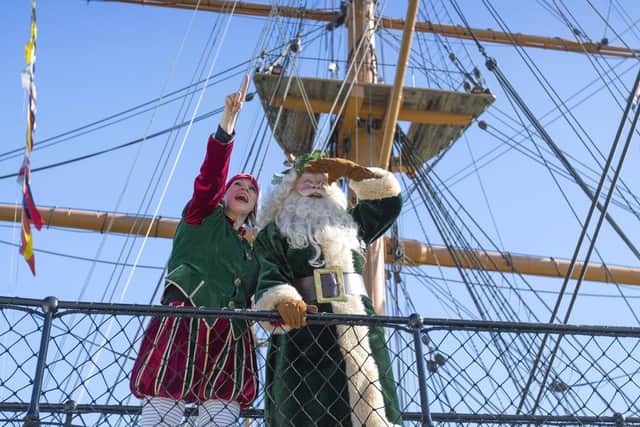 Father Christmas and Miss Chief on the bridge of HMS Warrior 1860 at Portsmouth Historic Dockyard's Festival of Christmas.  Picture: Chris Stephens.