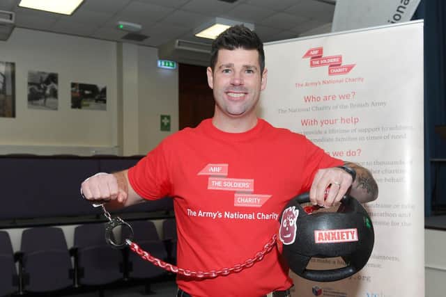 Sgt Andy Unwin has been handcuffed to a medicine ball for two weeks as part of a campaign to raise awareness of the hidden burden facing people with PTSD 
Picture: Sarah Standing (180835-1343)