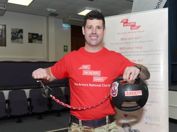 Sgt Andy Unwin has been handcuffed to a medicine ball for two weeks as part of a campaign to raise awareness of the hidden burden facing people with PTSD 
Picture: Sarah Standing (180835-1343)