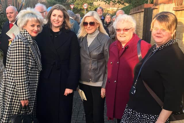 Penny Mordaunt, Portsmouth North MP with Port Solent residents.  They are celebrating finally having sound barriers installed along the M27 to block out the deafening roar of the highway.
