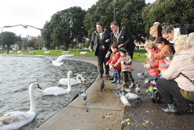 The Lord Mayor of Portsmouth Lee Mason with deputy Lord Mayor of Portsmouth David Fuller and staff and children from Canoe Lake Nursery, feeding the swans at Canoe Lake.