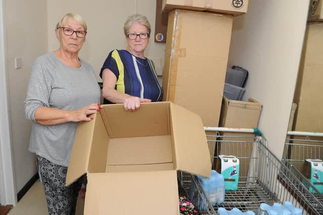 Frances Copping and Glenis Watts in the pantry where their food was stolen. The trolley and box pictured had been full of drinks and snacks for residents. Picture: Habibur Rahman