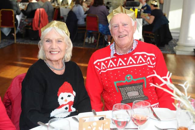 Mavis Manville, 83, and David McGregor, 83, enjoy their lunch at the Fellowship Christmas lunch. Picture: Sarah Standing