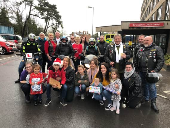 Gosport bikers with just a few of the presents they bought, staff, and their children outside QA Hospital in Cosham