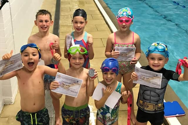 Children taking part in the Swim for Hope campaign