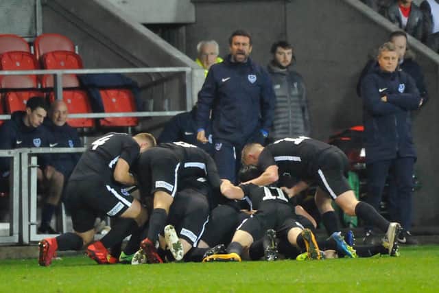Pompey celebrate Joe Hancott's equaliser at Liverpool. Picture: Colin Farmery