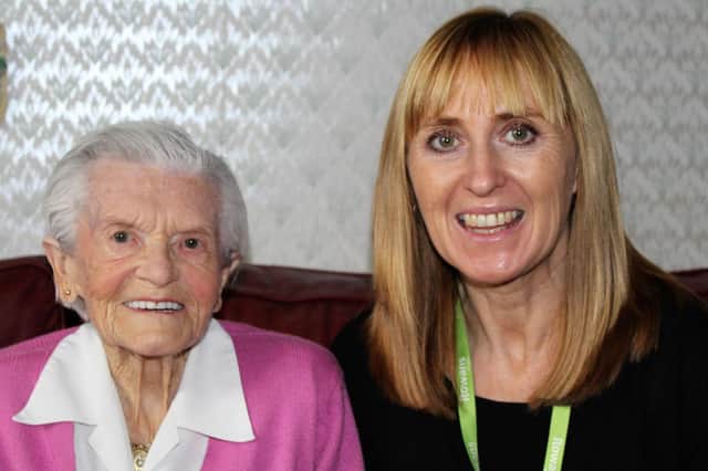 Daring Doris Long MBE, a world record holder after abseiling down the Spinnaker Tower at the age of 101 in 2015 to raise money for the Rowans, with Hospice Companion Ruth Davies