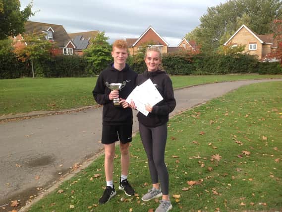 Vigilant House team captains Jack Mardell and Maisie Pannell receive the Bonding Day Trophy