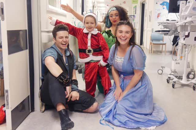 George O'Shaughnessy, 5,  meeting the Peter Pan cast. Yasmine Gazzal is Tinkerbell, Sam Bailey is Peter Pan and Hannah McIver is Wendy. Picture: Habibur Rahman