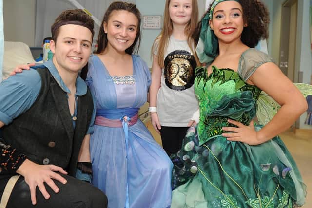 Millie-Ruby Turvey, 8, meeting the Peter Pan cast - Yasmine Gazzal as Tinkerbell, Sam Bailey as Peter Pan and Hannah McIver as Wendy. Picture: Habibur Rahman
