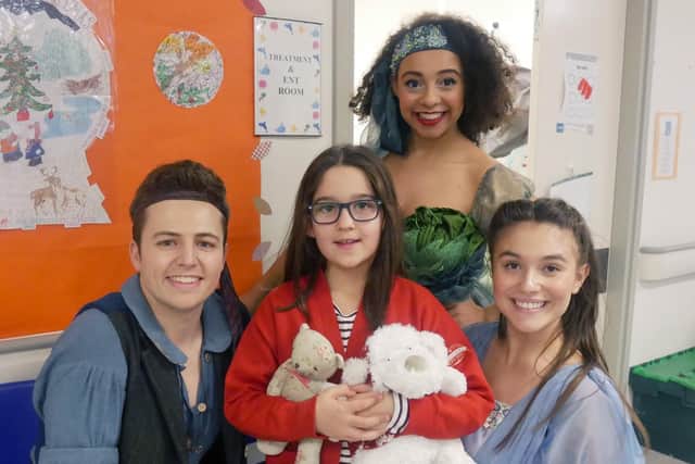 Tilly Scholfield, 8 with the Peter Pan cast - Yasmine Gazzal as Tinkerbell, Sam Bailey as Peter Pan and Hannah McIver as Wendy. Picture: Habibur Rahman