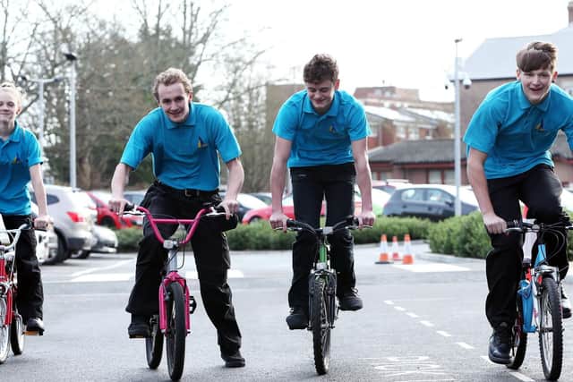 Pupils from left, Georgina Price, 15, Austin-Slade Jeffery, 15, Joe Packham 15 and Nathan Burman, 16, who have all been involved in recycling the bikes.