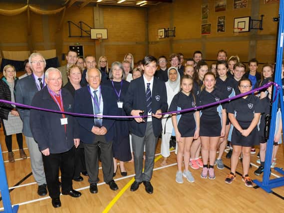 Bailey King officially unveils the new sports hall floor with councillors, staff and pupils.
Picture: Sarah Standing (180878-3972)