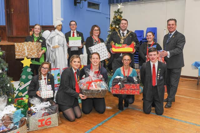 Pupils and staff at Mayfield Primary and Secondary School made hampers for Society of St James which needs help over Christmas with supplies.
Lord Mayor of Portsmouth Cllr Lee Mason, with staff of Mayfield school, members of the Society of St James and some of the pupils.
Picture: Habibur Rahman
