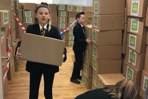 Year 7 students helping with the distribution of food parcels.