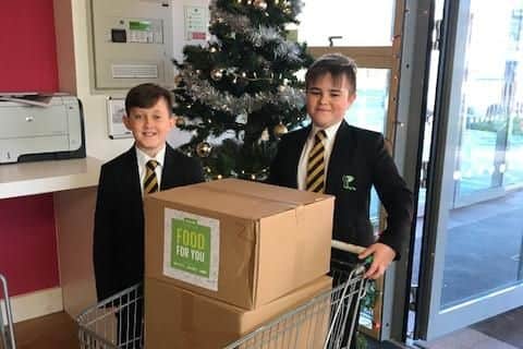 Year 7 pupils working hard to ensure the local community don't go hungry this Christmas.