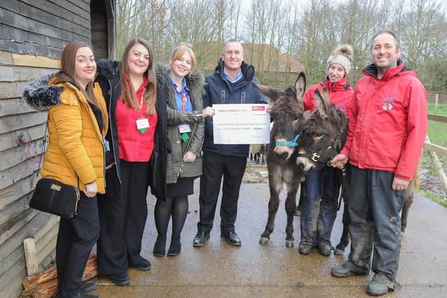 Pictured: CherryChildcare team, Katie Fitzpatrick, Jade Thomas, Emily Upton and Nigel Rolfe handing over a cheque to Tracey and Paul Hunt of Hayling Island Donkey Sanctuary. Picture: Habibur Rahman