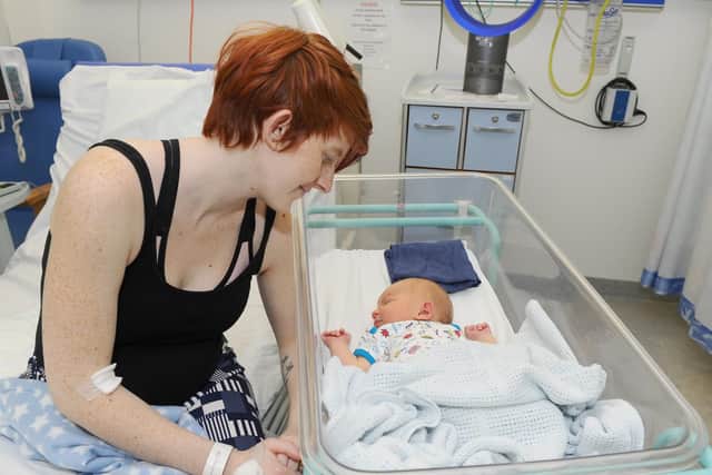 Leiana Ellery watches over her new son Xander
Picture: Sarah Standing (180887-4471)