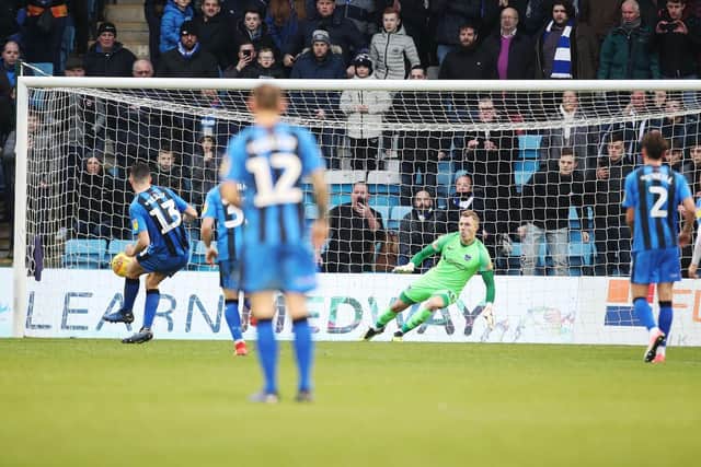 Callum Reilly nets a penalty for Gillingham against Pompey. Picture: Joe Pepler