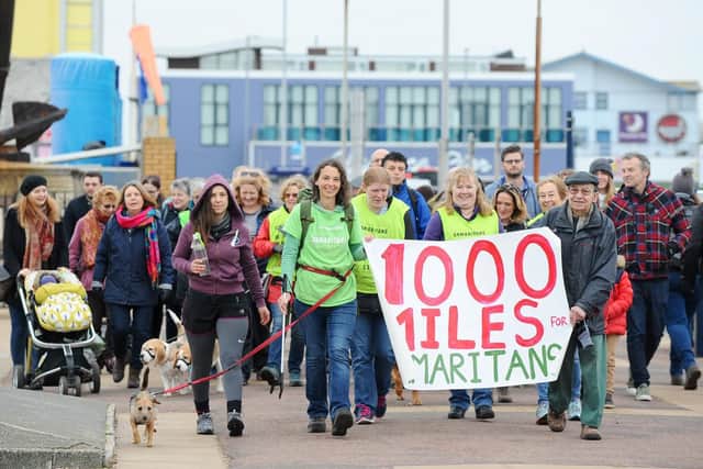 Frances Vigay completed her last mile from Clarence Pier to South Parade Pier in Southsea on New Year's Eve. Frances has walked 1,000 miles with her dog Pippa collecting plastic waste along the way in a bid to raise money for Samaritans. Picture: Sarah Standing (180890-239)