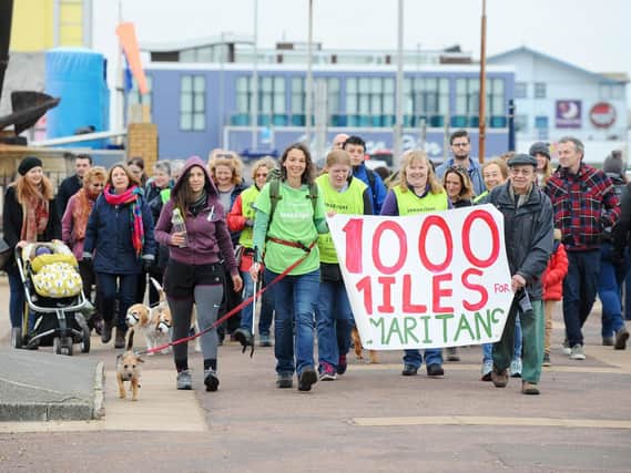 Frances Vigay completed her last mile from Clarence Pier to South Parade Pier in Southsea on New Year's Eve. Frances has walked 1,000 miles with her dog Pippa collecting plastic waste along the way in a bid to raise money for Samaritans. Picture: Sarah Standing (180890-239)