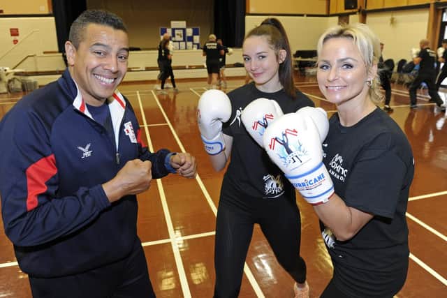 Q Shillingford, left, instructs Millie Lawrence and Malvina Price at the launch event for the new Heart of Hayling Boxing Club, in funded by the Lions. Picture: Ian Hargreaves