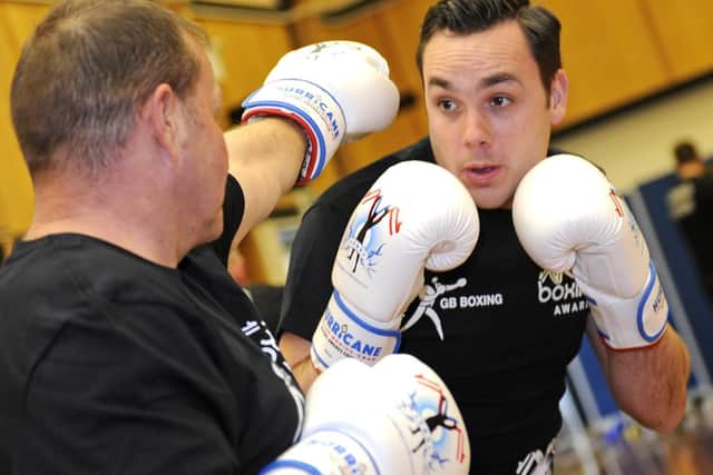 Firefighter Paul Hawker, left, and PC Stuart Grover at the launch event for the Heart of Hayling Boxing Club, funded by the Lions. Picture: Ian Hargreaves