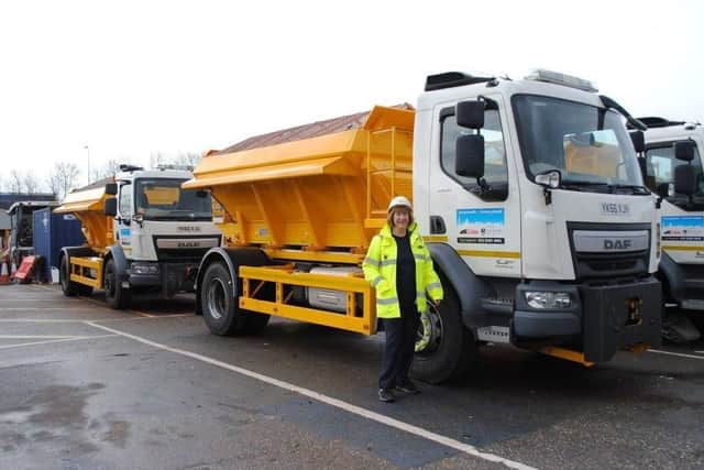 Councillor Lynne Stagg with one of the gritting lorries