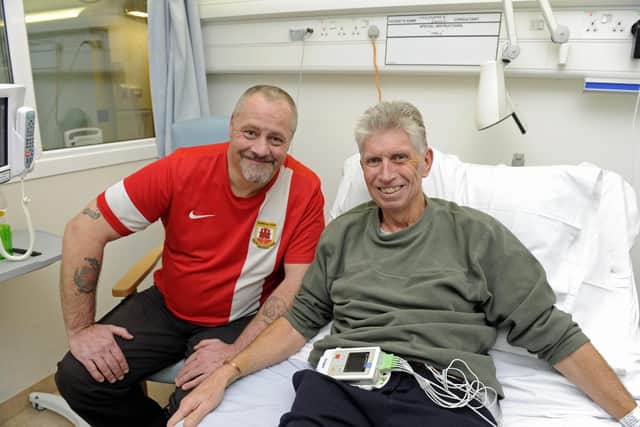 Pompey fan Chris Scovell, right, meets Steve Sedgewick at Queen Alexandra Hospital after Steve saved his life by administering CPR after he collapsed from a heart attack in Portsmouth Picture Ian Hargreaves (020119-1)