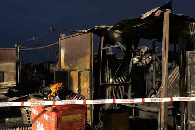 The aftermath of the fire at a yard in Sheepwash Lane, which destroyed a car repair and furniture restoration workshop and horse stables