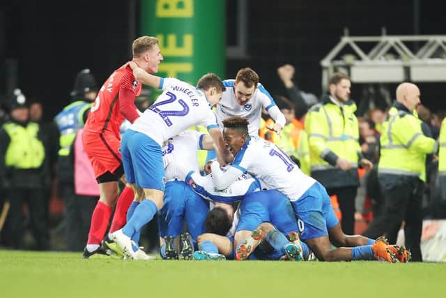 Pompey celebrate their late winner. Picture: Joe Pepler
