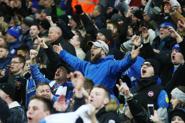 The Pompey fans celebrate at the final whistle at Carrow Road Picture: Joe Pepler