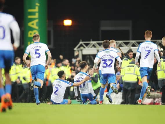 Andre Green is mobbed by Pompey's players following his Norwich match winner. Picture: Joe Pepler