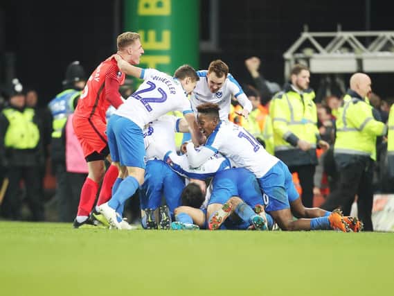 Pompey celebrations after their last-gasp victory at Norwich. Picture: Joe Pepler