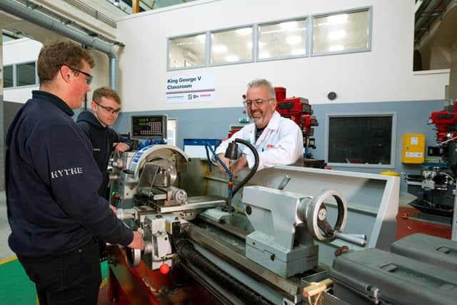From left, Hythe Marine apprentices Jordan Cooper and Conor Green, with Skills Trainer John Bundy. Picture: BAE Systems/Royal Navy