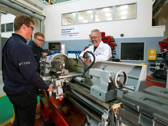 From left, Hythe Marine apprentices Jordan Cooper and Conor Green, with Skills Trainer John Bundy. Picture: BAE Systems/Royal Navy