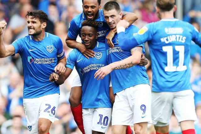 Pompey celebrate Jamal Lowe's first goal against Oxford. Picture: Joe Pepler