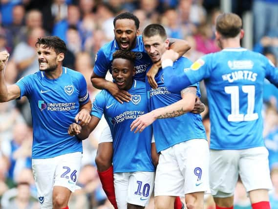 Pompey celebrate Jamal Lowe's first goal against Oxford. Picture: Joe Pepler
