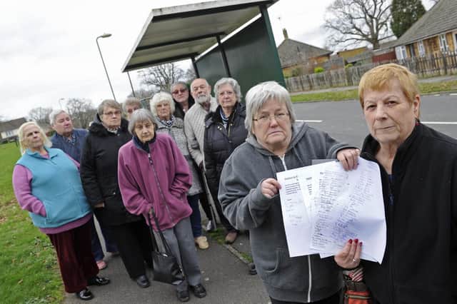 Residents protest at the cutting of the X9 bus service. Susan Wood, left, and Carole Oakes at the front
Picture Ian Hargreaves  (020119-1)
