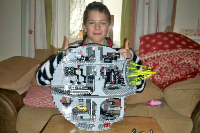 Simon Carter's son Ben, then aged nine, building the Death Star out of Lego.
