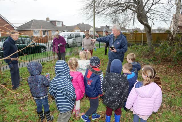 Volunteer David Harrison talks to the children Picture: Sarah Standing (110119-5589)