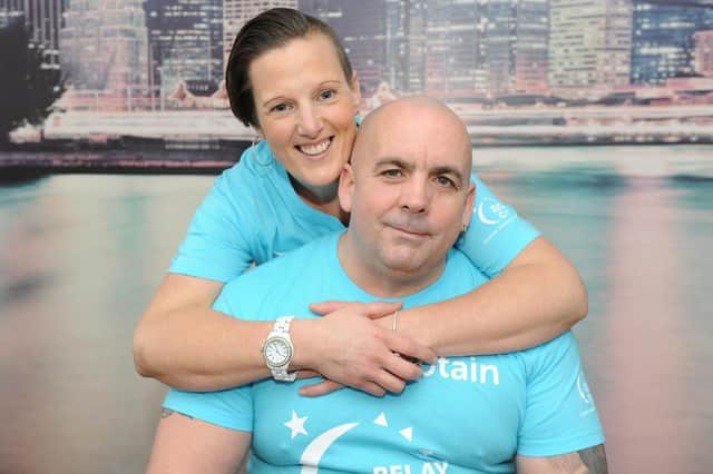 John Parker with his wife, Katy Parker, at their home in Havant. Both will be doing something brave for Cancer Research UK. Picture: Habibur Rahman