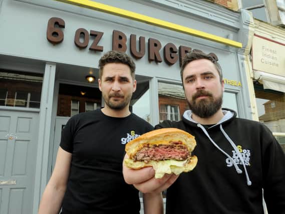 Piotr Mientkiewicz, left, and James Baldry of 6oz Burgers in Southsea in 2015 with one of the 'pink' burgers 
Picture: Paul Jacobs (150495-9)