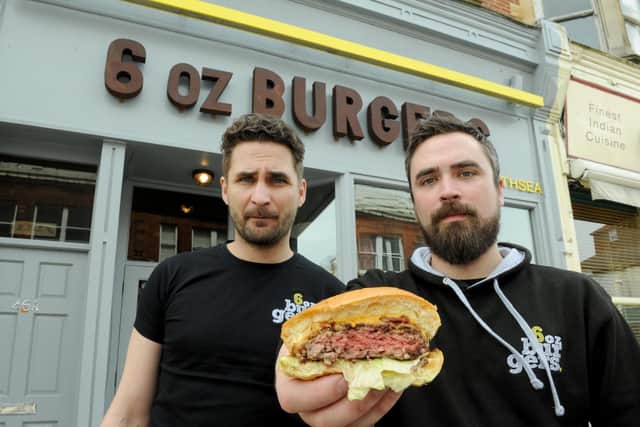 Piotr Mientkiewicz, left, and James Baldry of 6oz Burgers in Southsea in 2015 with one of the 'pink' burgers 
Picture: Paul Jacobs (150495-9)
