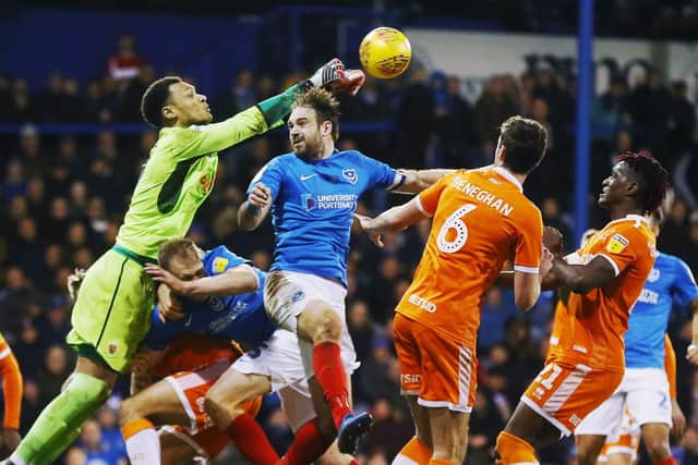 Blackpool keeper Christoffer Mafoumbi punches the ball clear of danger Picture: Joe Pepler
