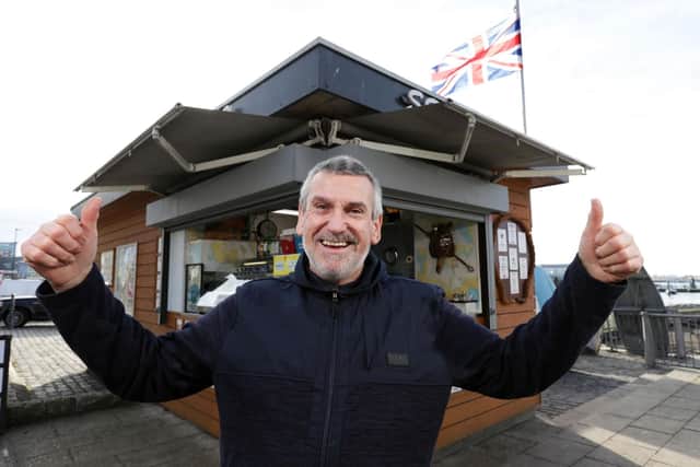Bim Hartgill celebrates after Portsmouth City Council reversed a decision to not renew his lease at Hartgill Seafoods kiosk, The Hard  Picture: Chris Moorhouse (130119-44)