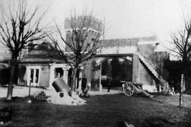 The main gate of HMS Vernon looking out on to St George's Road with cannon and mortar on display. Photo: Barry Cox Collection.