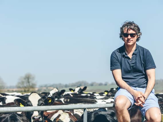 Jack Martin with his cows at his business Tom Parker Creamery in Exton. Picture by Alex Lawrence.