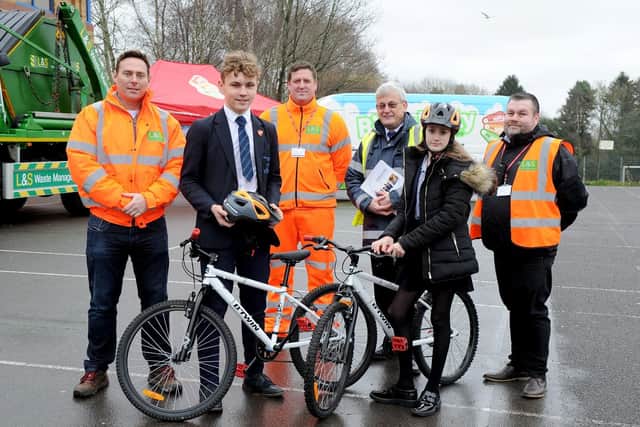 Michael Newham Wnuk, 16, and Maisie Godden-Hall, 13, alongside L&S Waste Management team, Matt Trace, Lee Carter, and Steve Hale (L to R orange jackets) and Tim Finch (yellow jacket), Oaklands health and safety lead.  

Picture: Habibur Rahman