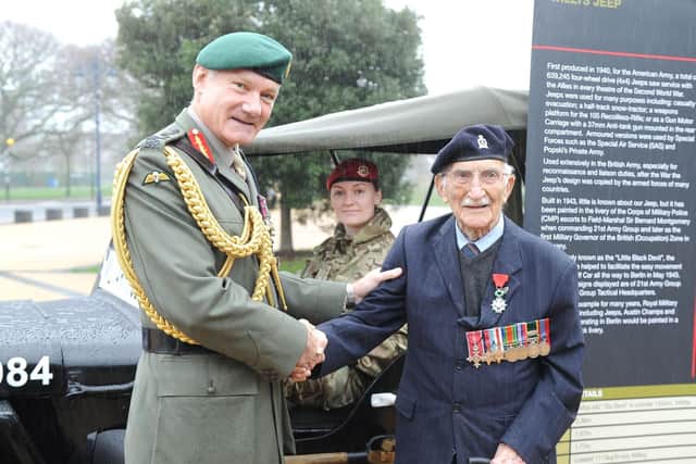 General Sir Gordan Messenger, Staff Sargent Stephanie Cotterill, and veteran John Jenkins, 99, of Portsmouth.   

Picture: Habibur Rahman